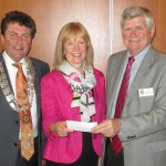 Presentation of Cheque to President Jim and Treasurer Helen by PP John